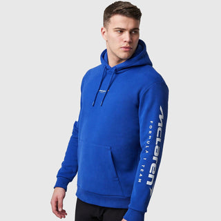 Man wearing a blue McLaren Formula 1 Team logo hoodie