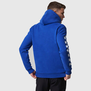 Back view of a person wearing a blue McLaren F1 Dynamic Pack logo hoodie.