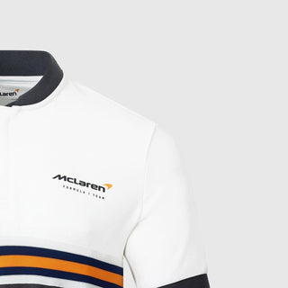 White McLaren Formula 1 Team polo shirt with grey collar and orange stripes.